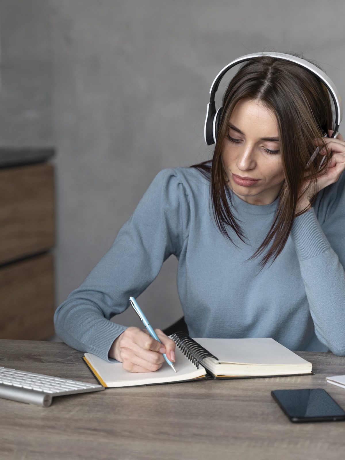 front-view-woman-working-media-field-with-headphones